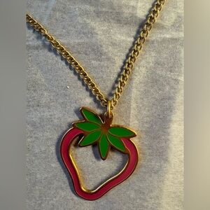 Gold tone and Pink Foxy brand Strawberry Necklace with Green Leaf Accent